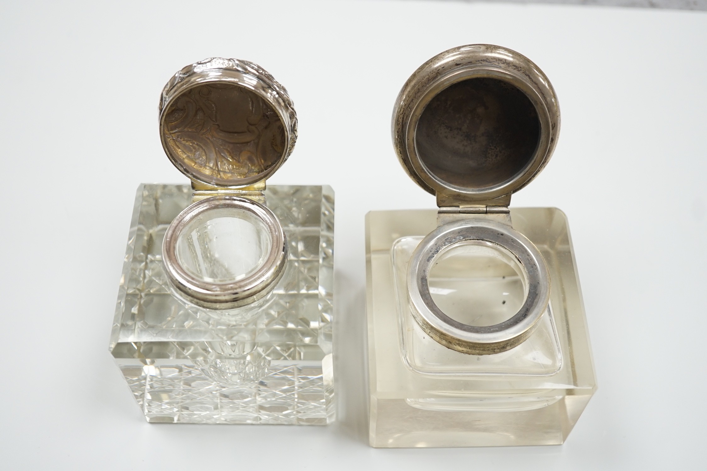 Two silver mounted cut glass inkwells, including Birmingham, 1902, height 92mm.